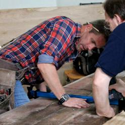 Jeff Devlin, professional carpenter and host of I Hate My Bath, re-works reclaimed red pine planks from Pioneer Millworks for a bathroom remodel.